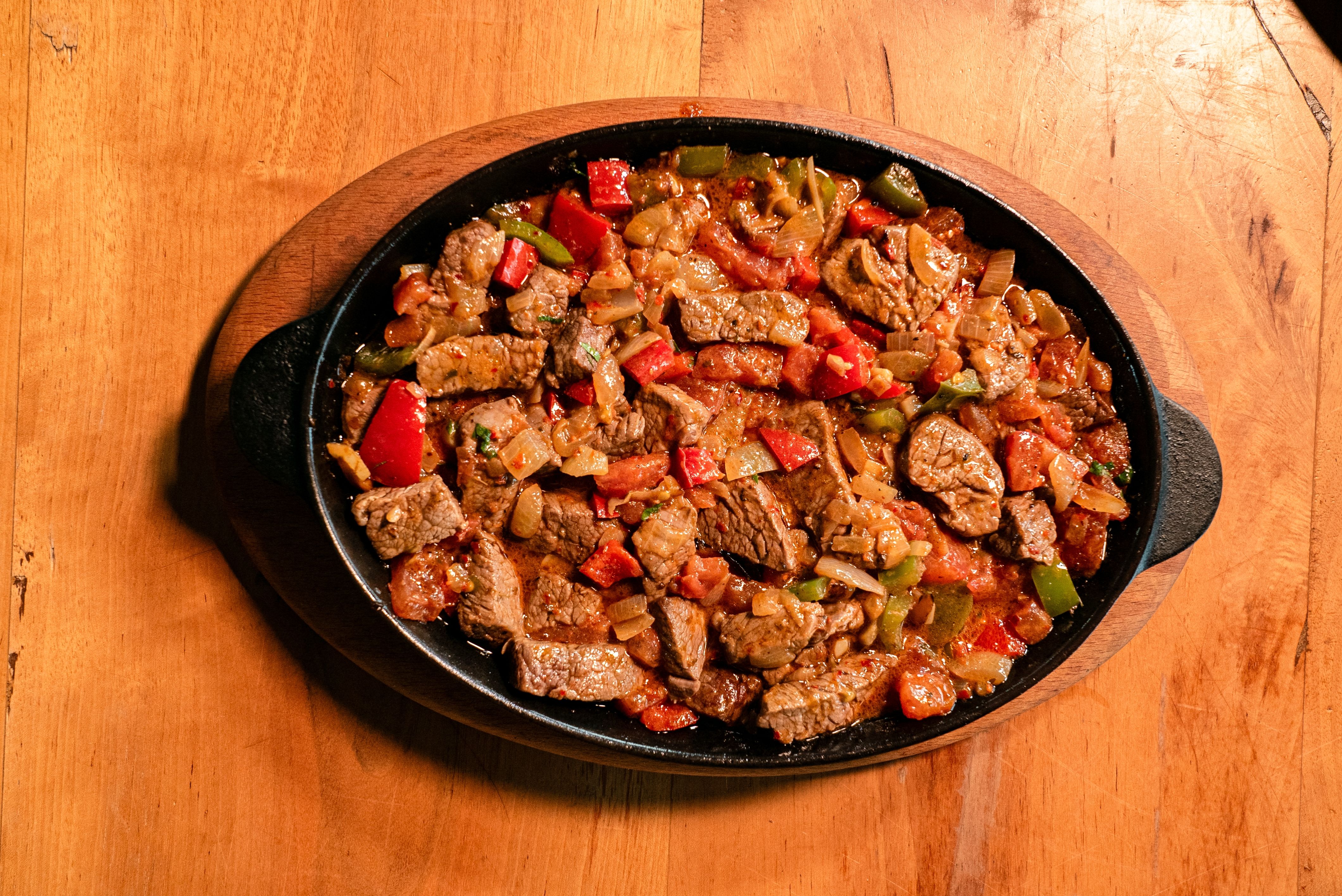 Sizzling beef fajita skillet with peppers and onions